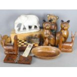 A collection of treen, animal carvings, chess set and a carved stone elephant.