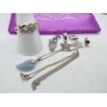 A silver chain, 46 cm (l) with five silver and stone set pendants,