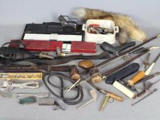 A box of mixed collectables to include sardine dish, black powder pouch / dispenser, fox tail,