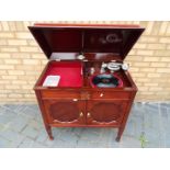 A twin door mahogany cabinet gramophone by Gilbert, approximately 82 cm x 83 cm x 52 cm.