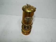 A brass miners lamp,