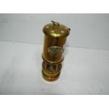 A brass miners lamp,