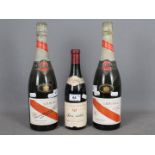 Two standard bottles of G H Mumm Cordon Rouge champagne,