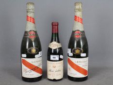 Two standard bottles of G H Mumm Cordon Rouge champagne,