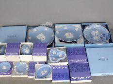 A quantity of boxed Wedgwood Jasperware items including plates and trinket boxes.