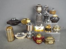 Tobacciana - A good collection of table lighters to include novelty examples a ceramic cased Minton
