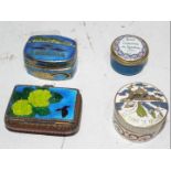 Four enamelled pill boxes,