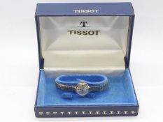 A lady's 9ct gold cased Tissot wristwatch on 9ct bracelet, 17 jewel signed movement,