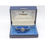 A lady's 9ct gold cased Tissot wristwatch on 9ct bracelet, 17 jewel signed movement,