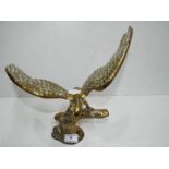 A brass figurine depicting an eagle, approx 29.