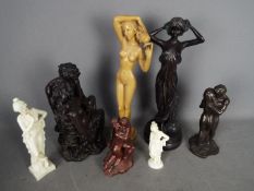 A collection of decorative figurines depicting nudes and couples, largest approximately 39 cm (h).