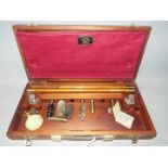 A vintage, wooden cased Lightwood gun cleaning kit.