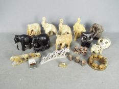 Animal figurines, elephants, owls, monkeys, comprising stone, resin, wooden and similar examples.