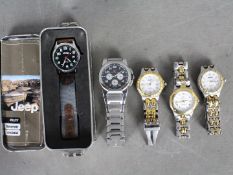 A small collection of wristwatches.