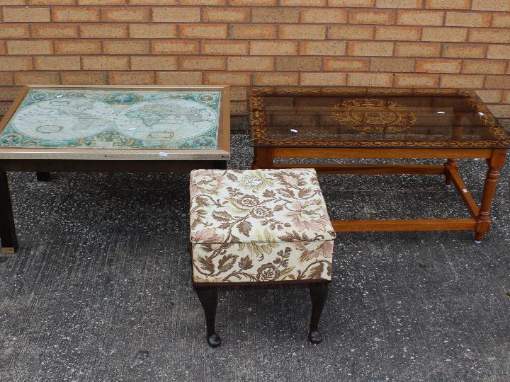 Two coffee tables and an embroidered sewing box with contents.
