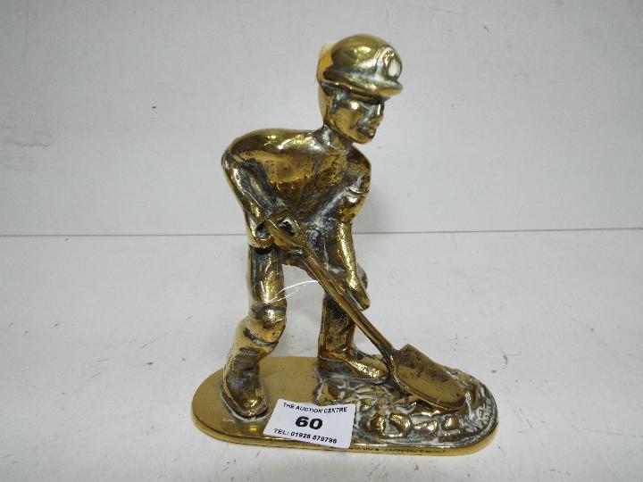 A brass figure in the form of a coal miner, approx 15.
