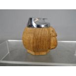 Tobacciana - Robert Mouseman Thompson, an octagonal carved table lighter with signature mouse,