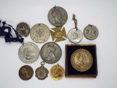 A collection of commemorative medals / medallions, Victorian, Edwardian and later.