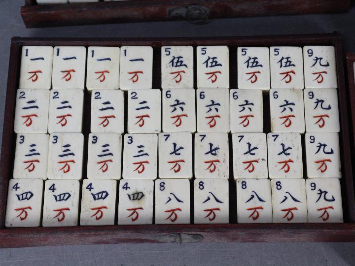 A vintage Mahjong set, wooden case with five drawers housing bone and bamboo tiles, - Image 2 of 16