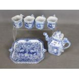 A Chinese blue and white tea set comprising teapot, four cups and tray,