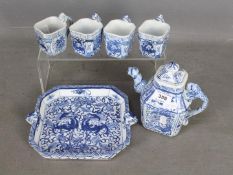 A Chinese blue and white tea set comprising teapot, four cups and tray,