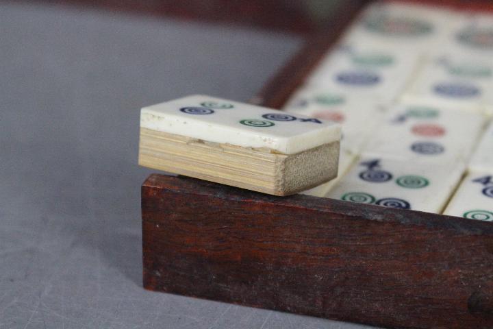 A vintage Mahjong set, wooden case with five drawers housing bone and bamboo tiles, - Image 16 of 16