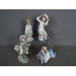 Four unboxed Lladro figurines, largest approximately 21 cm (h).