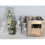 Lot to include decanters, bottle labels, vintage soda syphon, vintage bottles and other.