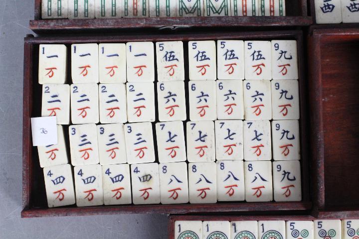 A vintage Mahjong set, wooden case with five drawers housing bone and bamboo tiles, - Image 12 of 16