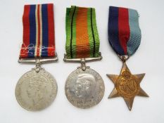 A World War Two (WWII / WW2) medal group comprising Defence Medal, War Medal and 1939 - 1945 star.