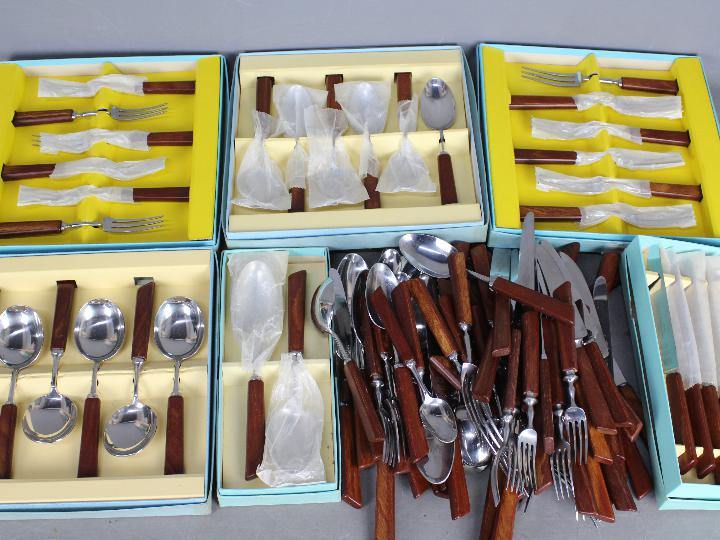 A quantity of cutlery, loose and boxed.