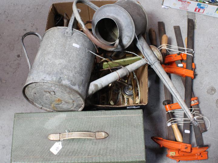 Mixed metal ware, clamps and a vintage Atlas sewing machine.