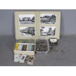 Lot to include cigarette cards, album of postcards with Isle of Wight examples,