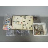 An All Nations Stamp Album containing a few stamps, a quantity of loose stamps,