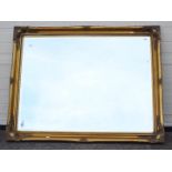 A large bevelled edge wall mirror, approximately 90 cm x 117 cm.