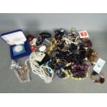 A quantity of costume jewellery to include necklaces, brooches, rings, bracelets and similar.