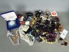 A quantity of costume jewellery to include necklaces, brooches, rings, bracelets and similar.