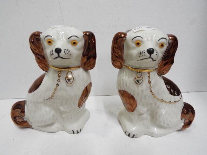 A pair of Staffordshire ceramic dogs,