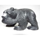 A carved wood Black Forest Bear with a Salmon in it's mouth approx height 17 cm (h)