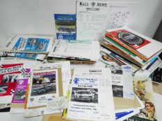 A collection of motorsport related ephemera to include race meeting official programmes,