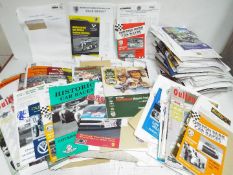 A large quantity of motorsport related ephemera including race meeting official programmes,