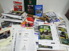 A collection of motorsport related ephemera including race meeting official programmes,