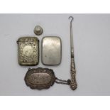 Lot to include a silver handled button hook, silver Sherry bottle label, silver thimble,