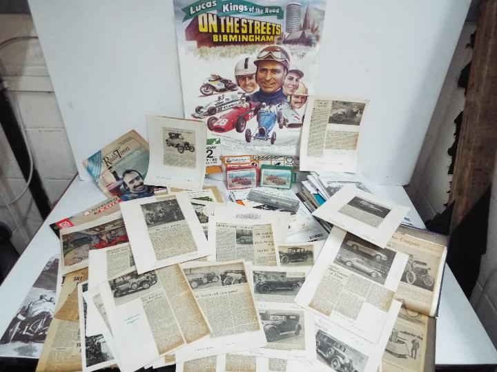 A collection of motorsport related ephemera including race meeting official programmes,