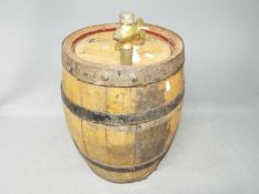 A small coopered barrel with brass tap, marked Mather Leeds,