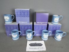 Wedgwood - Ten boxed pale blue Jasperware Christmas mugs