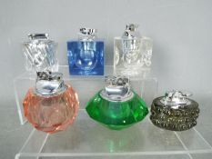 Tobacciana - Six glass table lighters of varying design, clear glass and coloured glass.