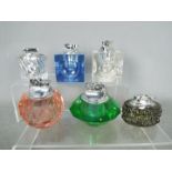 Tobacciana - Six glass table lighters of varying design, clear glass and coloured glass.