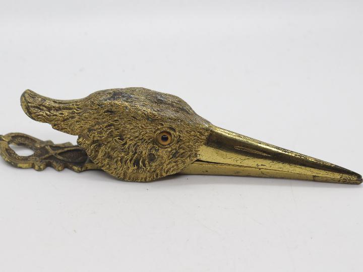 A late Victorian gilt metal paper clip in the form of a birds head, with glass eyes, - Image 2 of 4