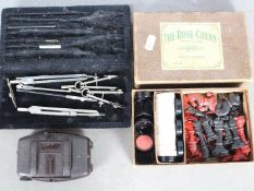 A vintage painted lead chess set The Rose, wit red and black pieces, contained in original box,